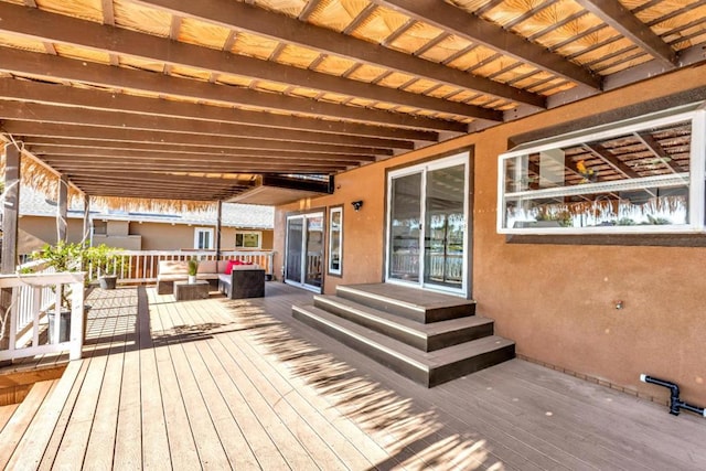 wooden terrace featuring an outdoor hangout area