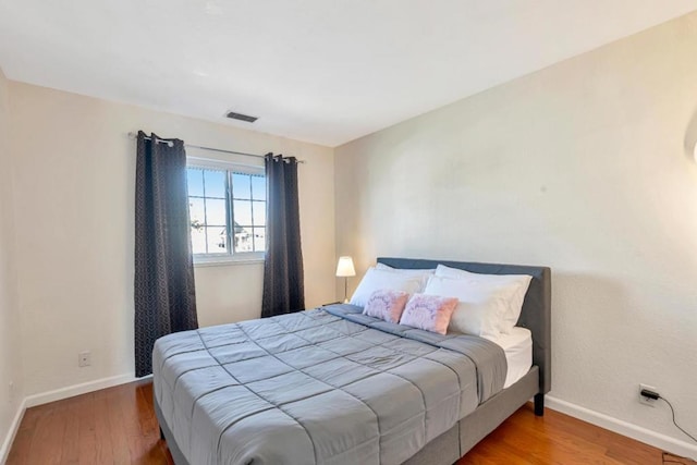 bedroom featuring hardwood / wood-style flooring