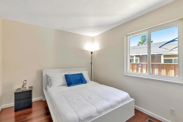 bedroom featuring dark wood-type flooring