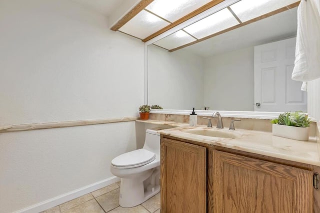 bathroom featuring tile patterned flooring, vanity, and toilet