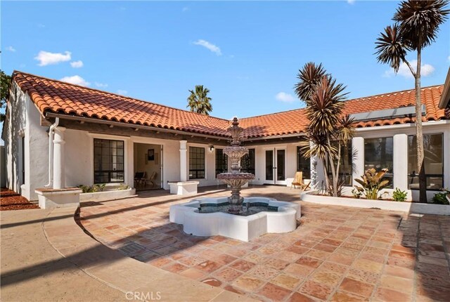 rear view of house with french doors