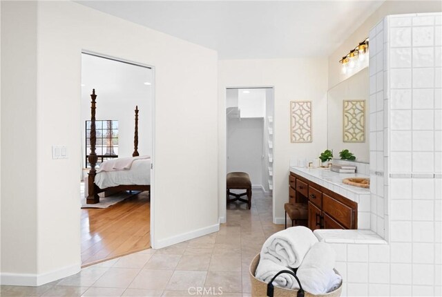 bathroom with vanity and tile patterned floors