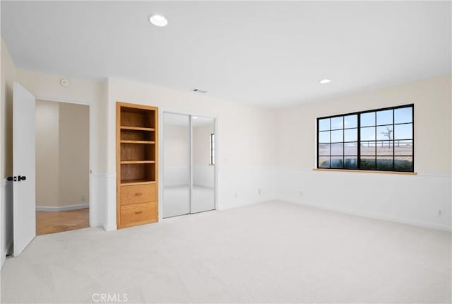 unfurnished bedroom featuring a closet and carpet