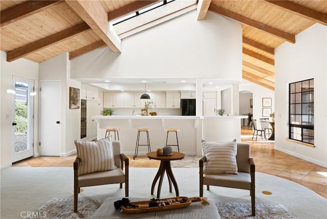 living room with beamed ceiling, light tile patterned flooring, high vaulted ceiling, and wooden ceiling