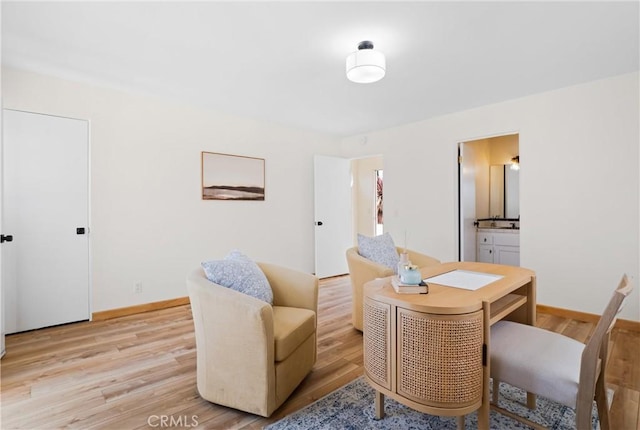 sitting room with light hardwood / wood-style floors