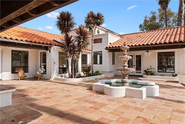 rear view of property with a patio