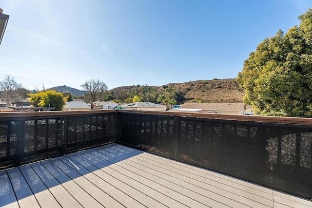 wooden deck featuring a mountain view