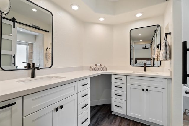 bathroom featuring vanity and hardwood / wood-style floors