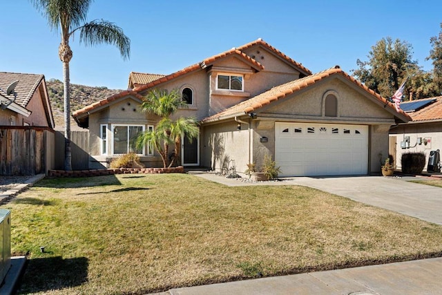 view of front of house with a garage and a front yard