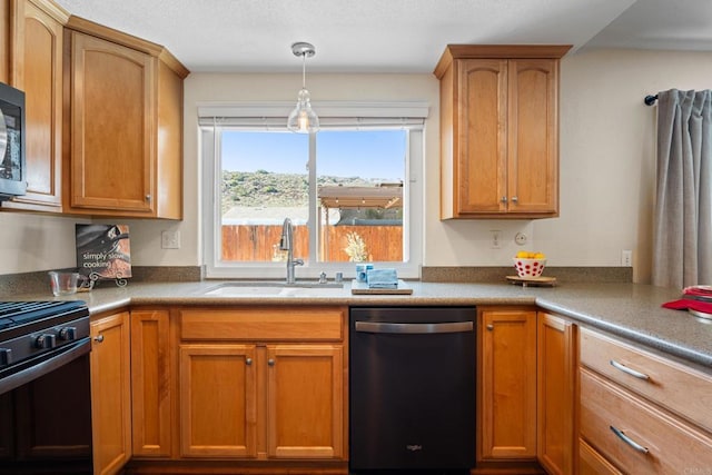 kitchen with sink, hanging light fixtures, and black appliances