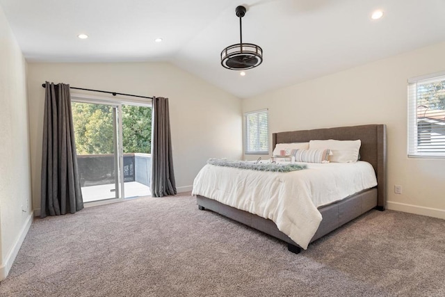 carpeted bedroom with vaulted ceiling, multiple windows, and access to outside