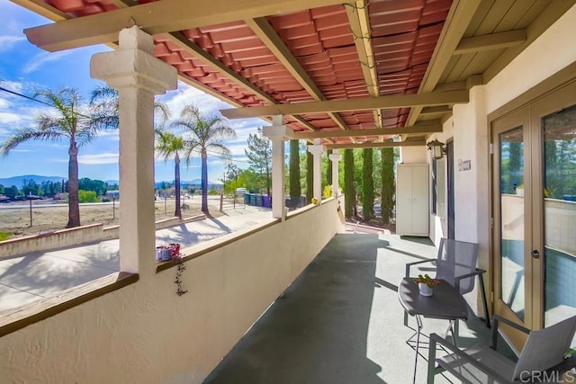 view of patio / terrace featuring a balcony and a mountain view