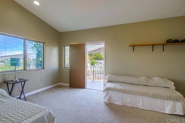 bedroom featuring lofted ceiling, carpet floors, and access to outside