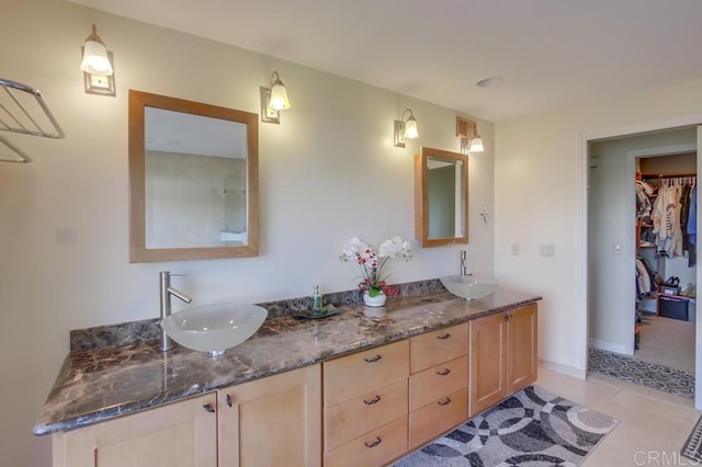 bathroom with vanity and tile patterned floors