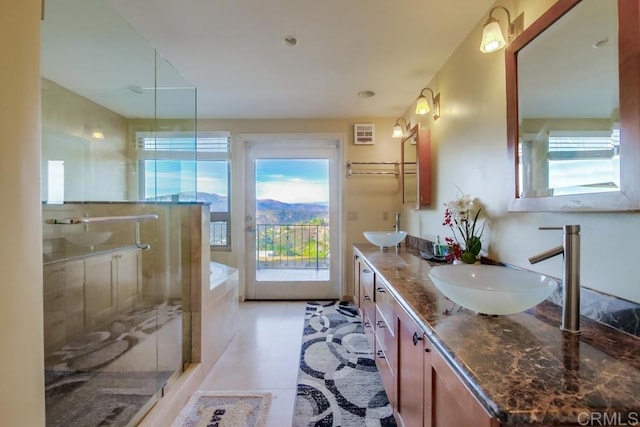 bathroom with an enclosed shower and vanity