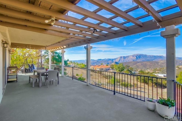 view of patio featuring a mountain view and a pergola