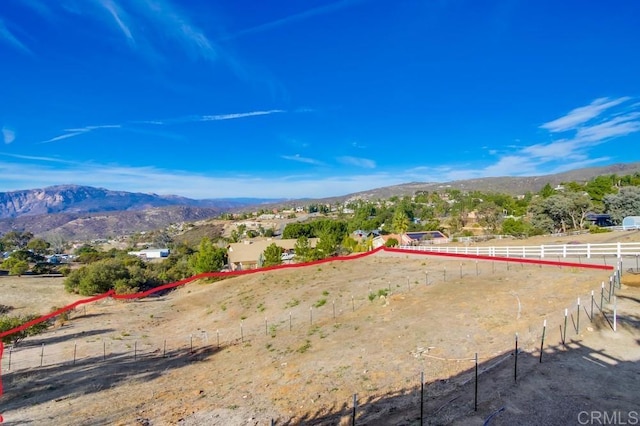 exterior space featuring a rural view and a mountain view