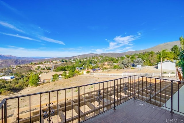 balcony with an enclosed area and a mountain view