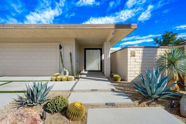 view of exterior entry featuring a garage