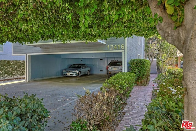 view of vehicle parking featuring a carport