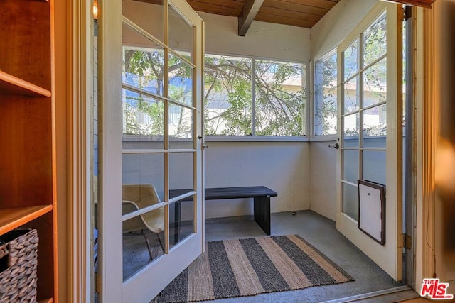 sunroom / solarium with beamed ceiling and plenty of natural light