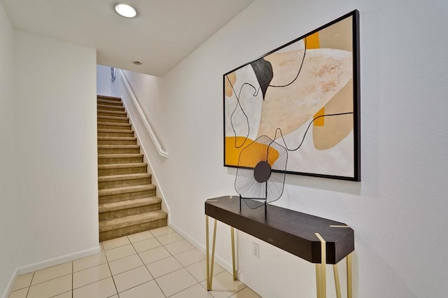 stairs with tile patterned floors