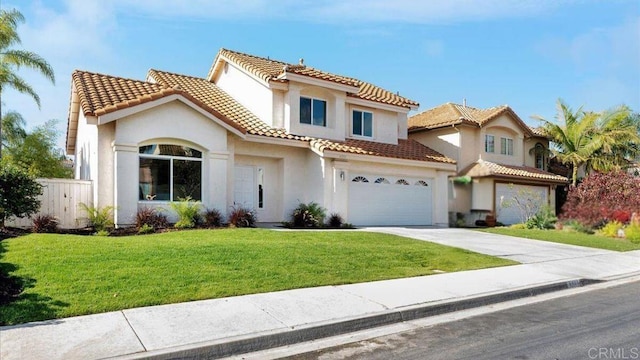 mediterranean / spanish house with a garage and a front yard