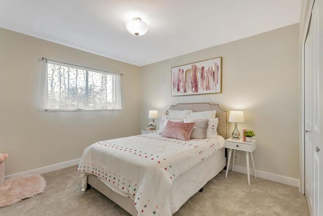 bedroom featuring light colored carpet