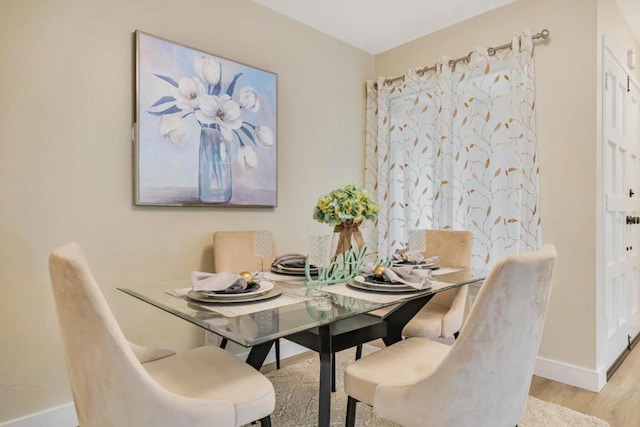 dining room featuring light hardwood / wood-style floors