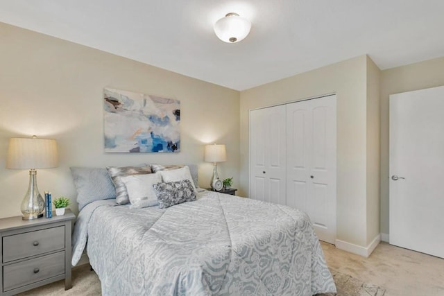 carpeted bedroom featuring a closet