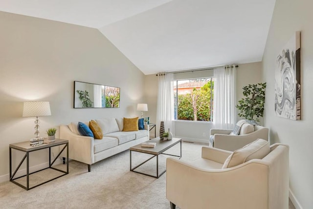 carpeted living room featuring lofted ceiling