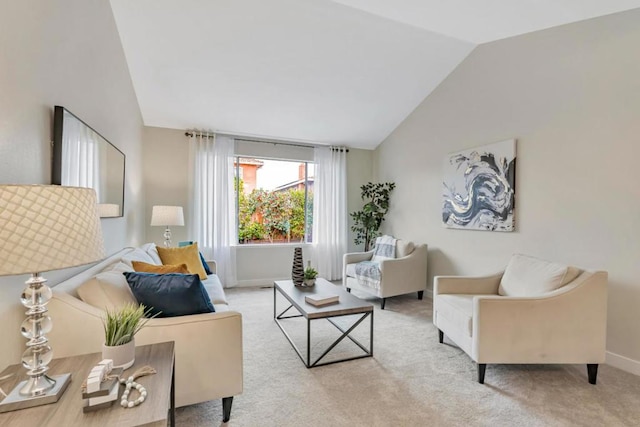 living room with lofted ceiling and light carpet