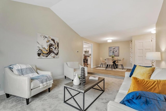 living room featuring lofted ceiling