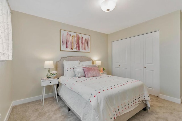 carpeted bedroom featuring a closet