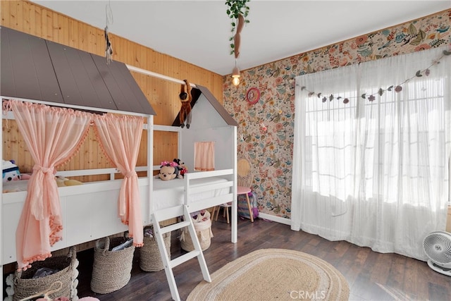 bedroom with dark hardwood / wood-style floors