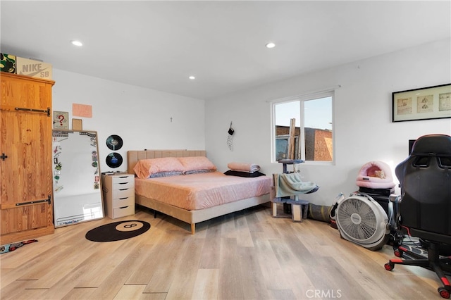 bedroom with light hardwood / wood-style floors