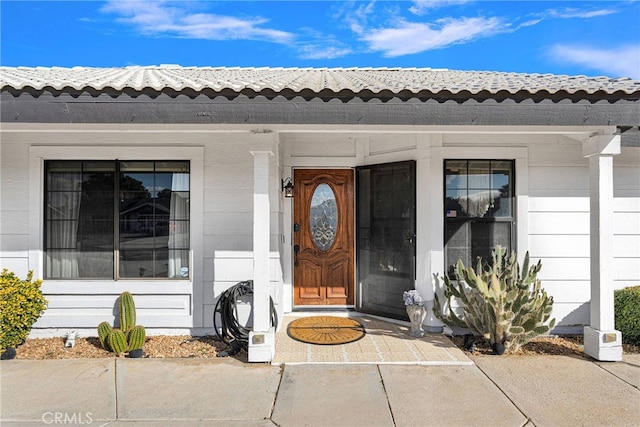 doorway to property featuring a porch