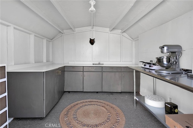 interior space featuring vaulted ceiling with beams