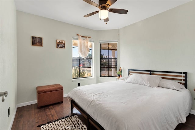 bedroom featuring ceiling fan and dark hardwood / wood-style flooring