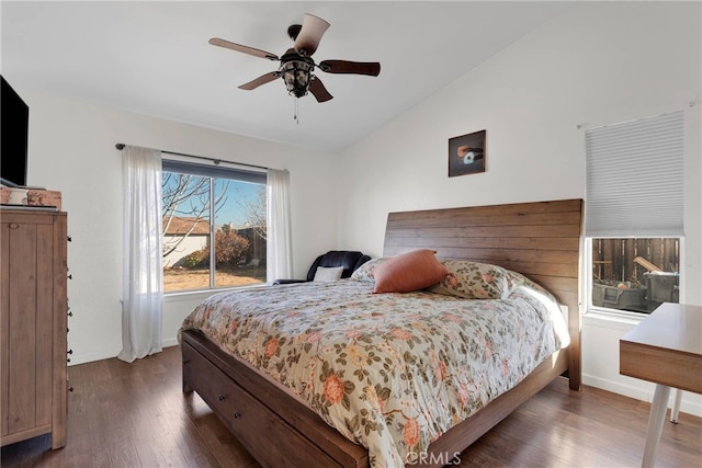 bedroom featuring lofted ceiling, dark wood-type flooring, and ceiling fan