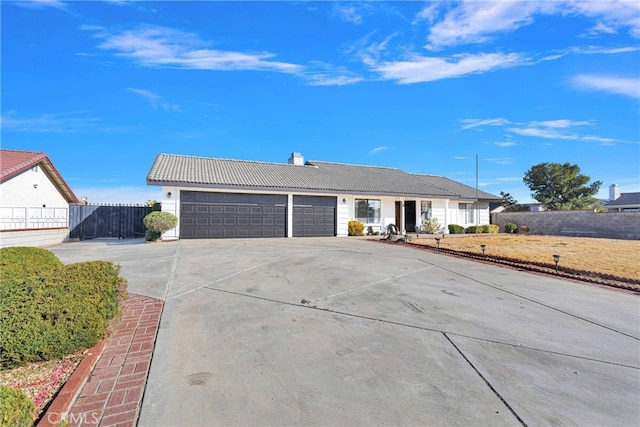 ranch-style home featuring a garage