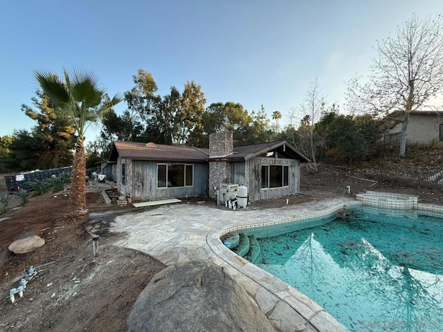 view of swimming pool with area for grilling and a patio area