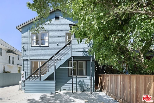 back of property with a patio area