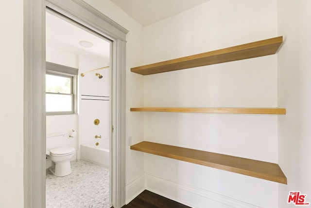 bathroom with  shower combination and toilet