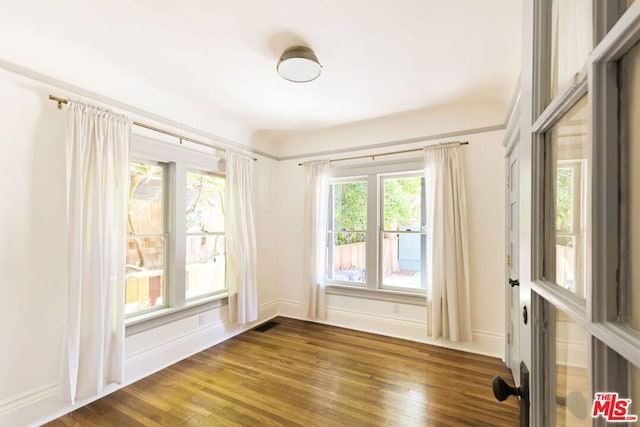 empty room featuring dark hardwood / wood-style floors