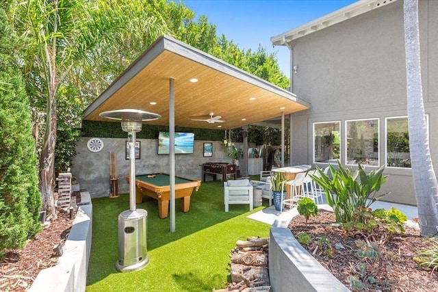 view of yard with ceiling fan