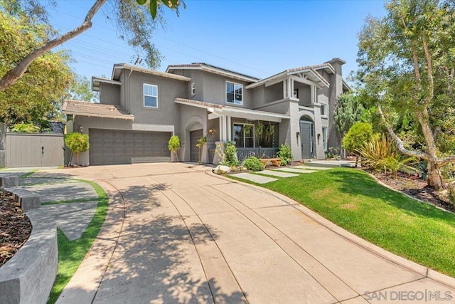 view of front of home featuring a garage and a front yard