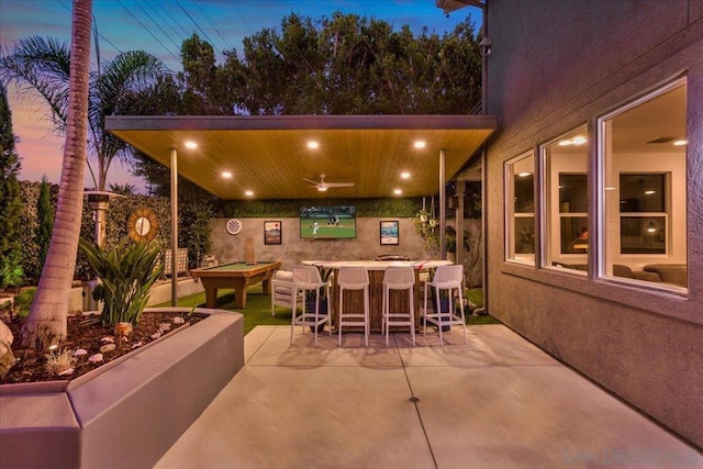 patio terrace at dusk with ceiling fan