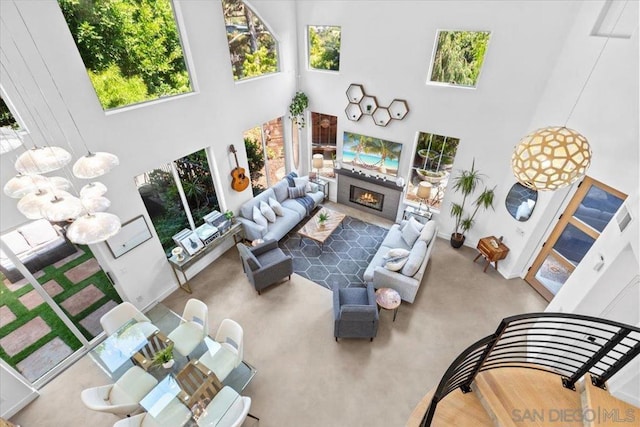 living room with a towering ceiling