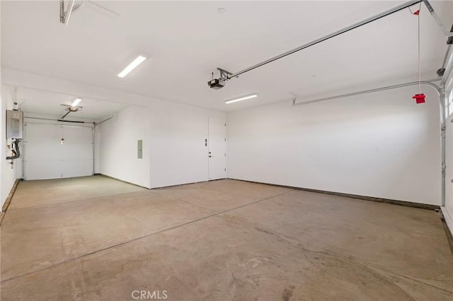 garage with a garage door opener, electric panel, and water heater